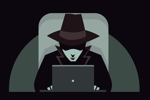 Man in Black Hat at Computer